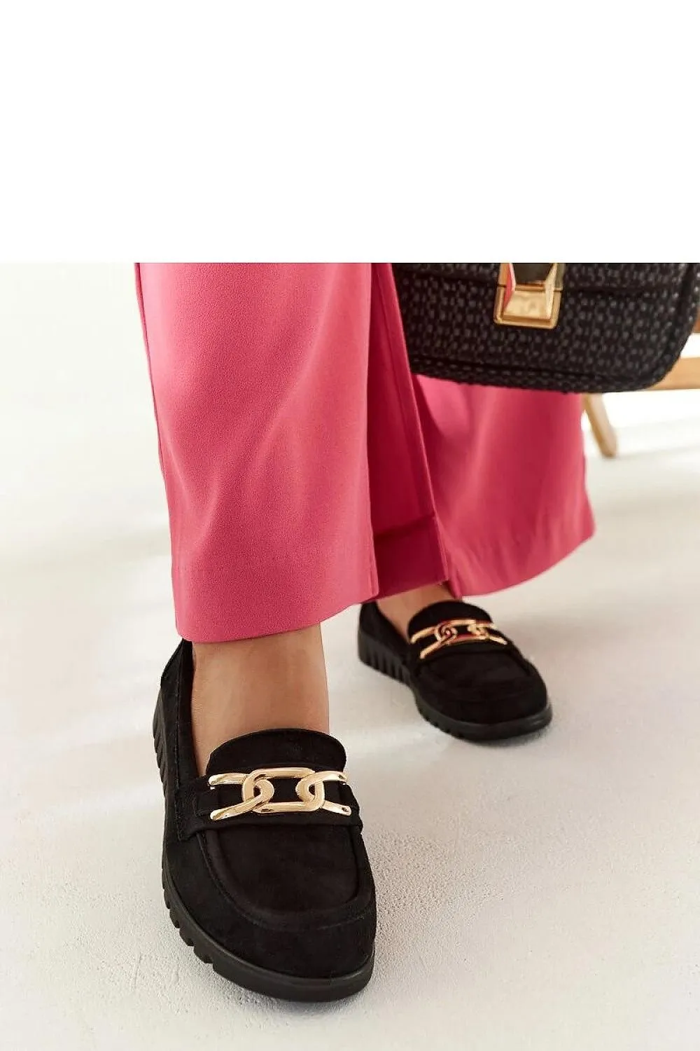 Black suede moccasins with a buckle