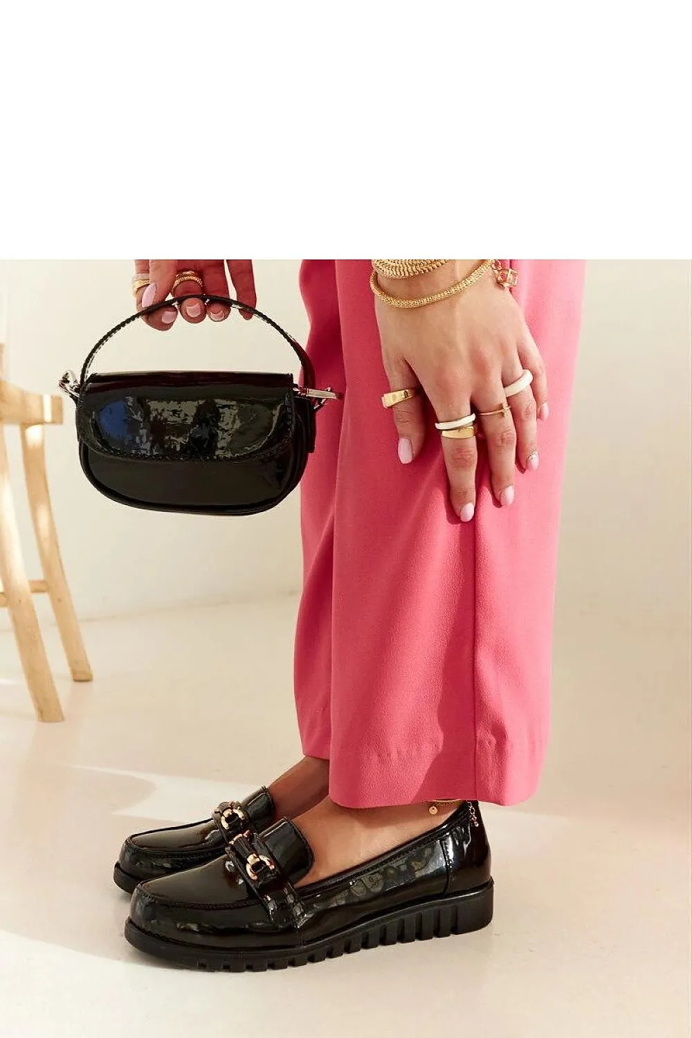 Black suede moccasins with a buckle