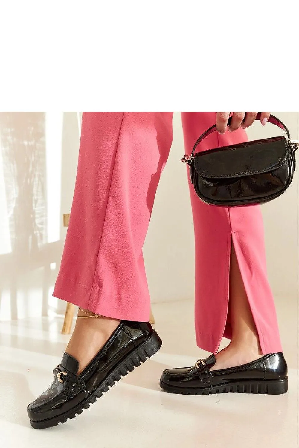 Black suede moccasins with a buckle